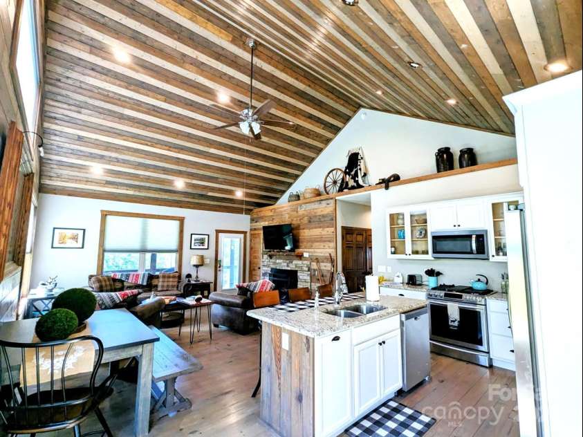 10 Rio Bravo Drive, Sylva, NC 28779.  MLS# CAR4296478, YatesRealty ID 2871. Kitchen island with sink and dishwasher