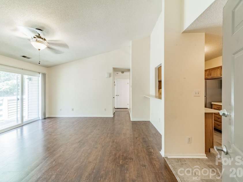 9605 Vinca Circle, Charlotte, NC 28213.  MLS# CAR4385047, YatesRealty ID 28719. Living area open to the kitchen