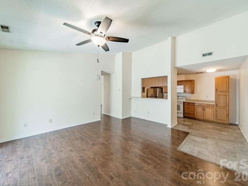 9605 Vinca Circle, Charlotte, NC 28213.  MLS# CAR4385047, YatesRealty ID 28719. Open great room with vaulted ceiling and kitchen view