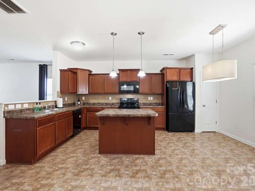 7095 Sonja Drive, Clover, SC 29710.  MLS# CAR4350064, YatesRealty ID 28721. Large kitchen with island