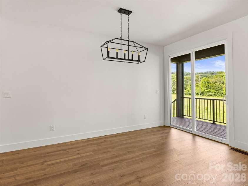 45 Klimovych Road, Hendersonville, NC 28792.  MLS# CAR4390237, YatesRealty ID 28727. DINING AREA, OVERLOOKING BACKYARD