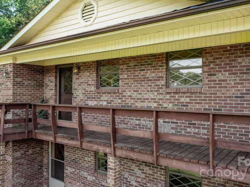 343 Highland Drive, Marion, NC 28752.  MLS# CAR4281875, YatesRealty ID 28741. Front deck