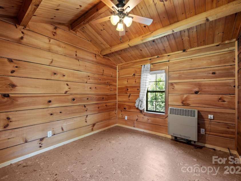 2978 NC 9 Highway, Black Mountain, NC 28711.  MLS# CAR4247540, YatesRealty ID 28749. Primary Bedroom with Propane Wall Furnace