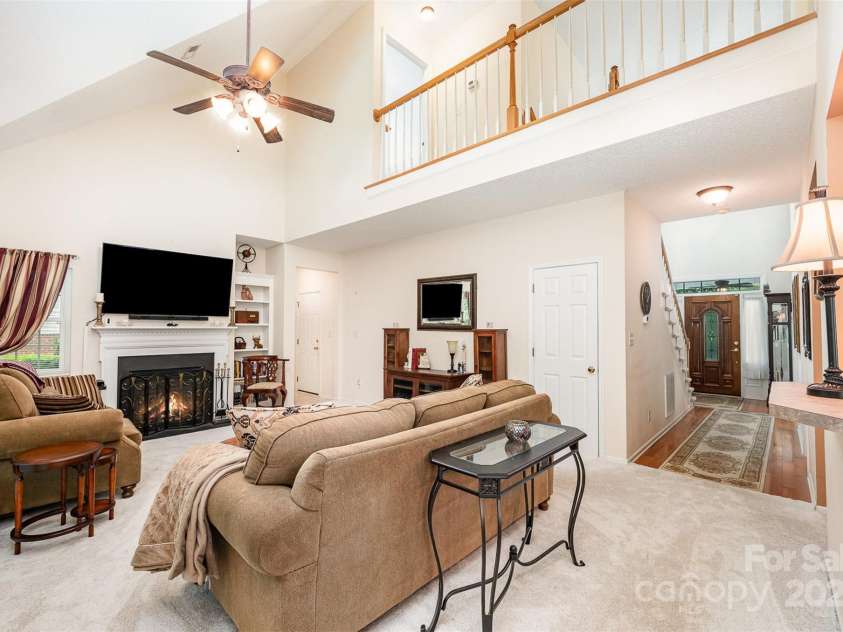 4042 River Falls Drive, Lowell, NC 28098.  MLS# CAR4283716, YatesRealty ID 28755. Virtually enhanced fireplace