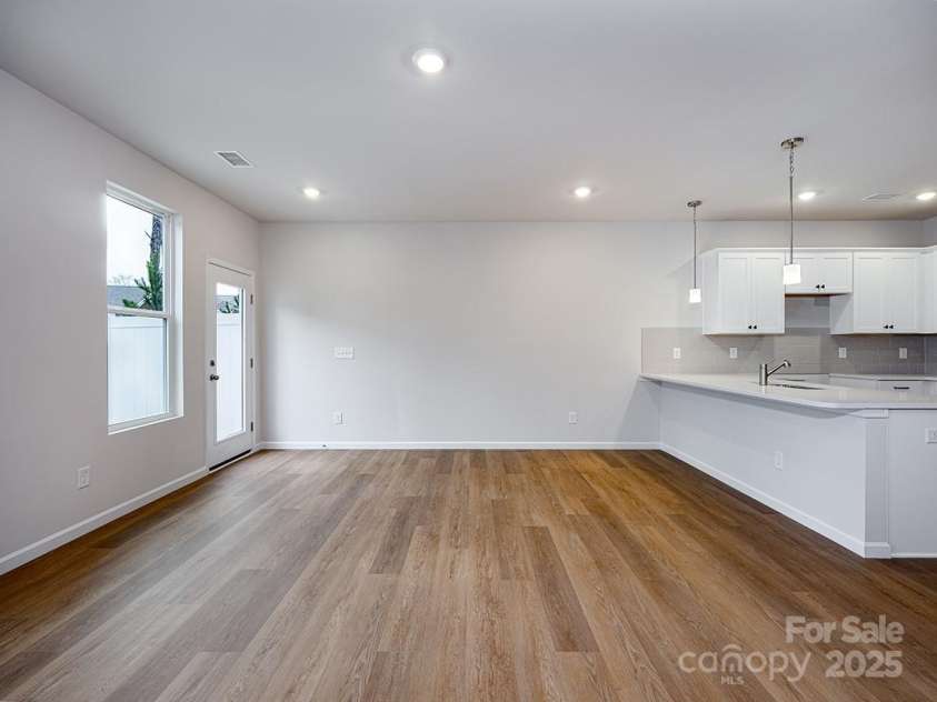 2535 Ruby Dixon Crossing Drive, Gastonia, NC 28056.  MLS# CAR4256272, YatesRealty ID 2876. Great room & Dining area