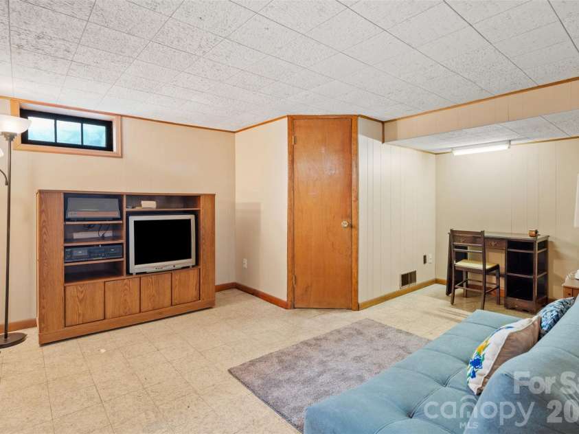 314 Old Leicester Highway, Asheville, NC 28806.  MLS# CAR4388057, YatesRealty ID 28763. Lower level bonus room