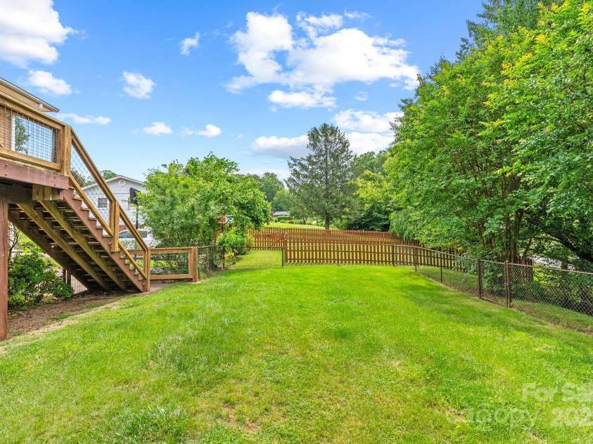 27 Dixon Terrace, Candler, NC 28715.  MLS# CAR4259784, YatesRealty ID 28771. Fenced in backyard