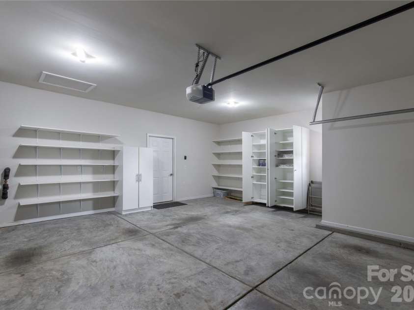 1079 Falling Leaf Street, Indian Land, SC 29707.  MLS# CAR4313558, YatesRealty ID 28772. Garage with extra shelving for storage
