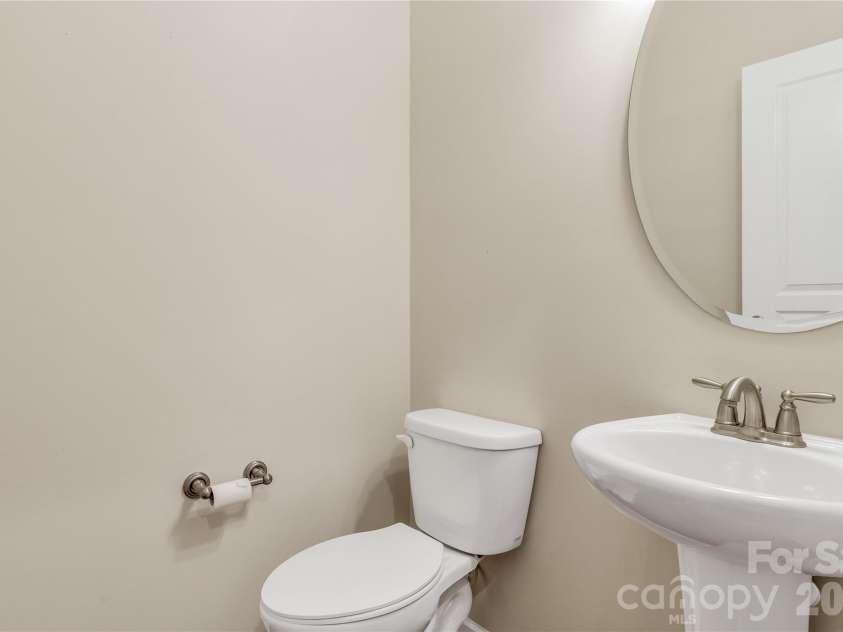 1079 Falling Leaf Street, Indian Land, SC 29707.  MLS# CAR4313558, YatesRealty ID 28772. Half bath near the laundry room