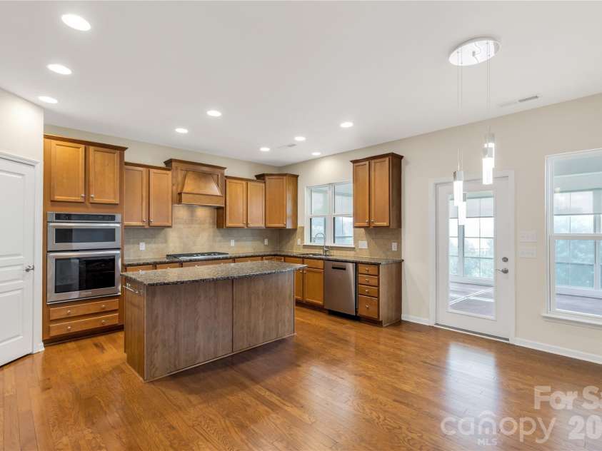 1079 Falling Leaf Street, Indian Land, SC 29707.  MLS# CAR4313558, YatesRealty ID 28772. Large eat-in kitchen with island