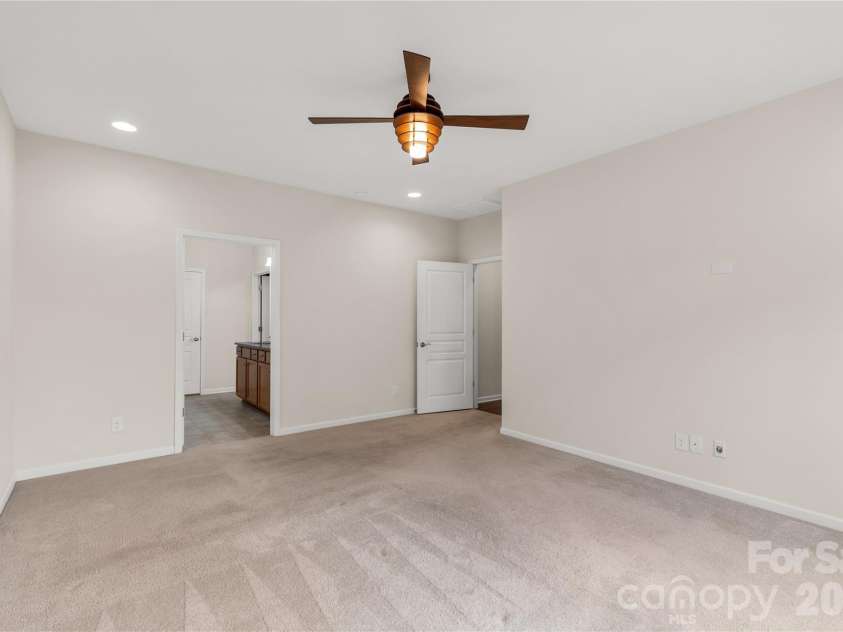 1079 Falling Leaf Street, Indian Land, SC 29707.  MLS# CAR4313558, YatesRealty ID 28772. Primary bedroom looking into bathroom