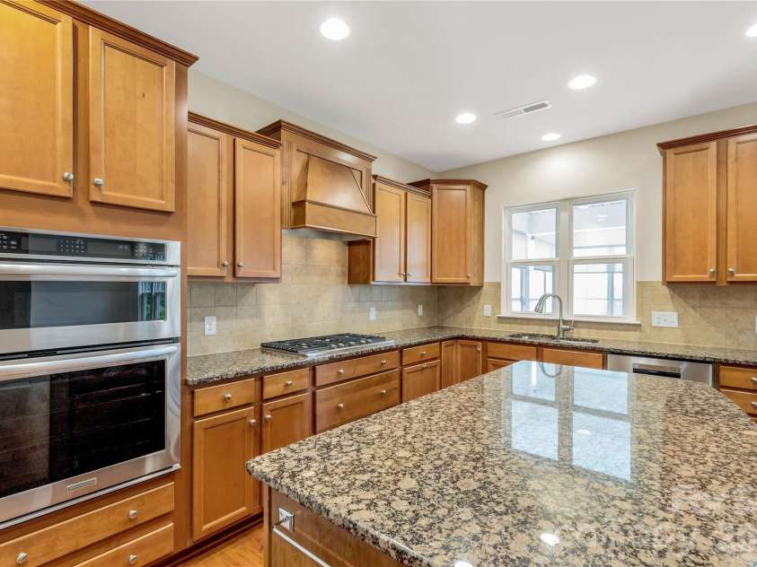 1079 Falling Leaf Street, Indian Land, SC 29707.  MLS# CAR4313558, YatesRealty ID 28772. Wall mount microwave and oven