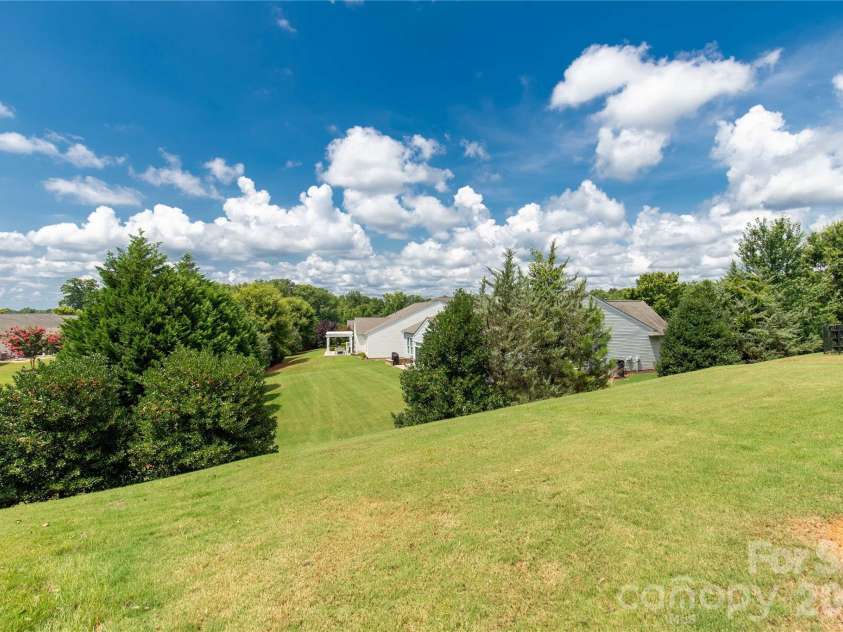 1079 Falling Leaf Street, Indian Land, SC 29707.  MLS# CAR4313558, YatesRealty ID 28772. Yard sits high and has privacy from neighbors