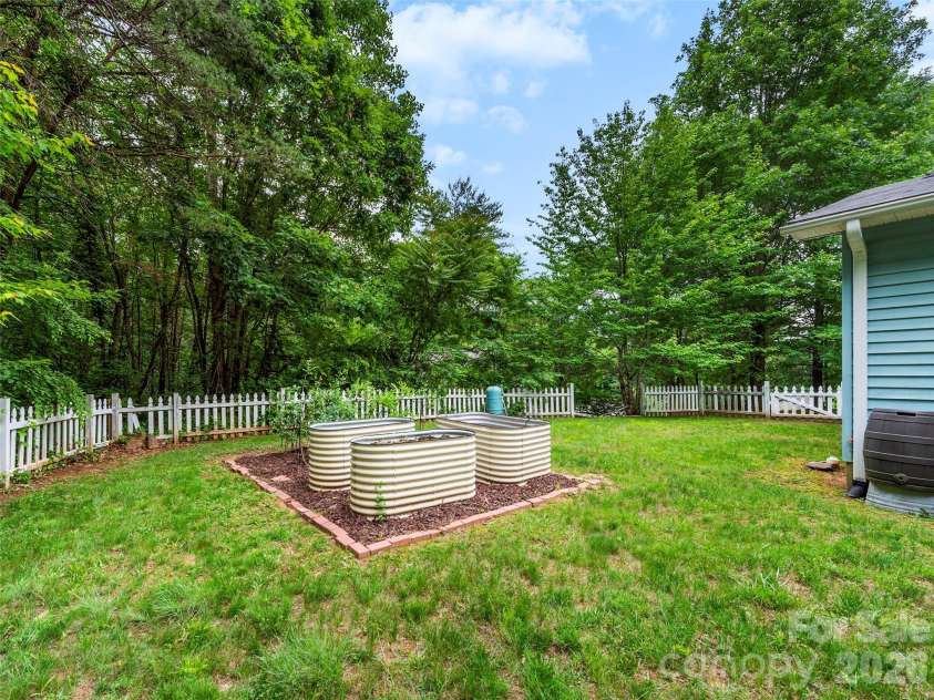 39 Rocking Porch Lane, Asheville, NC 28805.  MLS# CAR4389703, YatesRealty ID 28779. Container gardening ready for your veggies!