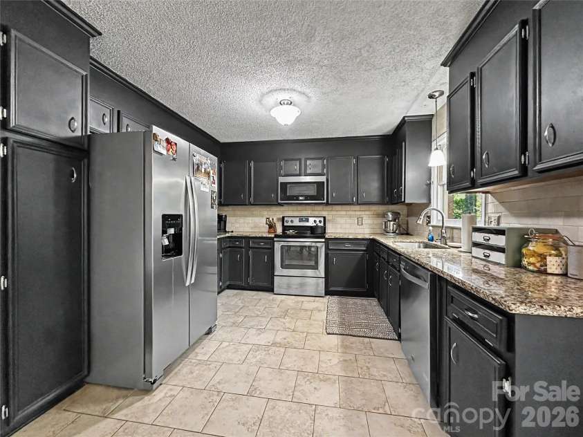 213 Bostian Lake Road, Statesville, NC 28677.  MLS# CAR4390171, YatesRealty ID 28780. 