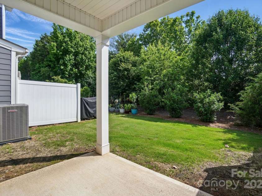 8018 Saluda Drive, Charlotte, NC 28269.  MLS# CAR4255269, YatesRealty ID 28789. Sip your morning coffee on the private covered patio overlooking a tranquil tree buffer