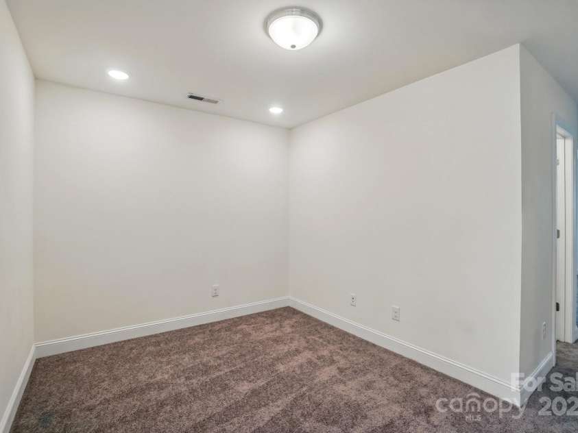 8018 Saluda Drive, Charlotte, NC 28269.  MLS# CAR4255269, YatesRealty ID 28789. Versatile loft—ideal for a home office, cozy reading nook, or your favorite hobby space