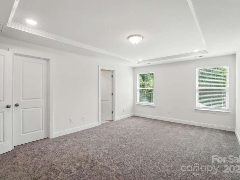 8018 Saluda Drive, Charlotte, NC 28269.  MLS# CAR4255269, YatesRealty ID 28789. Your private retreat with tray ceiling, walk-in closet, and spa-like en suite