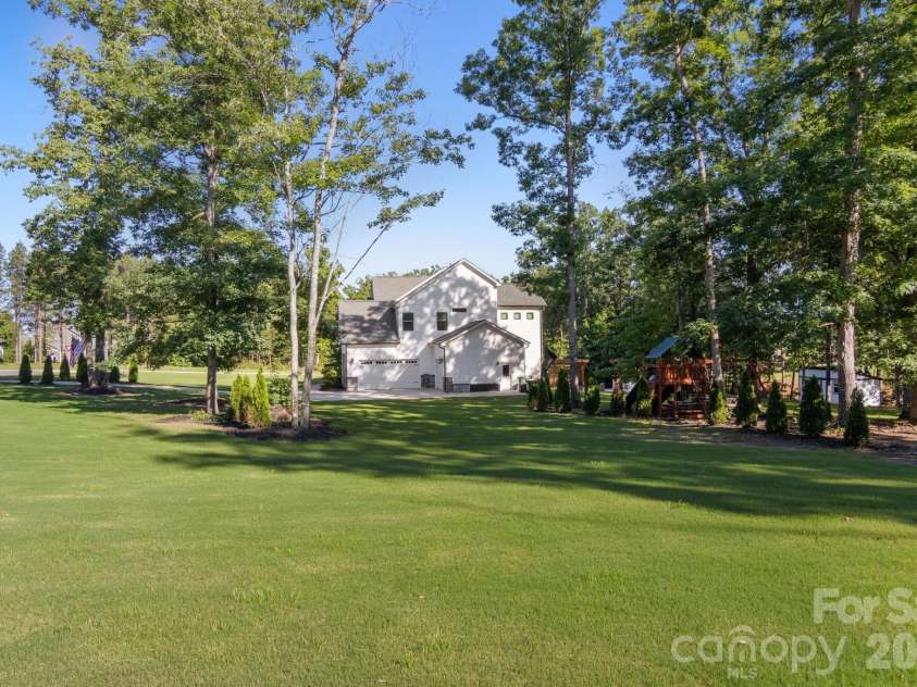 228 Herd Path Court, Clover, SC 29710.  MLS# CAR4387418, YatesRealty ID 28790. Side yard
