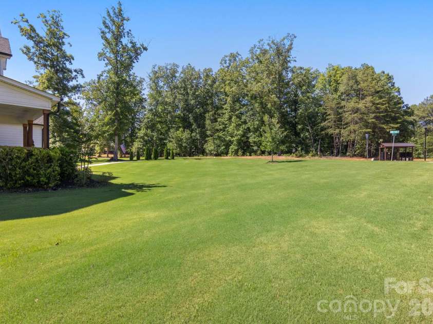 228 Herd Path Court, Clover, SC 29710.  MLS# CAR4387418, YatesRealty ID 28790. Side yard