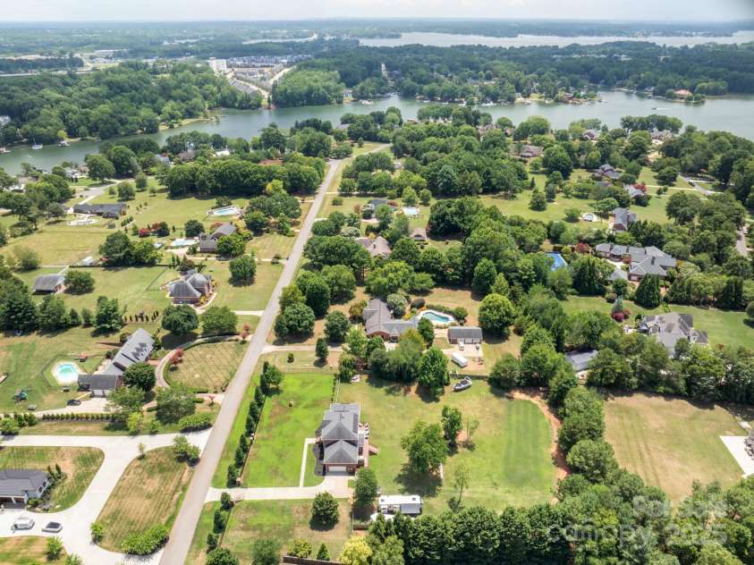 168 Harwell Road, Mooresville, NC 28117.  MLS# CAR4282323, YatesRealty ID 28807. Aerial shot from north side of property showing access to Lake Norman