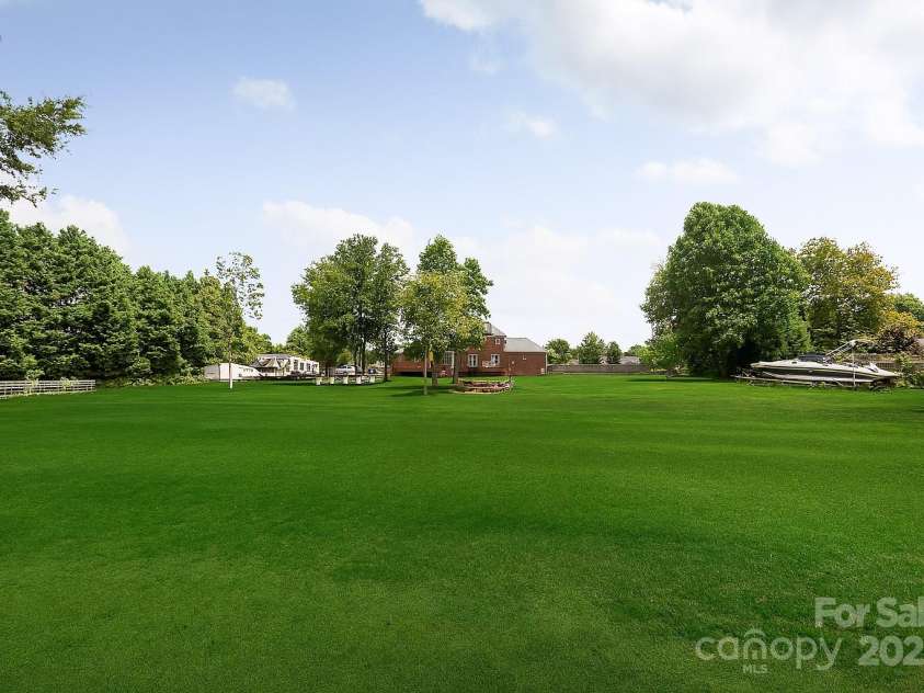 168 Harwell Road, Mooresville, NC 28117.  MLS# CAR4282323, YatesRealty ID 28807. Large back yard from middle of back fence