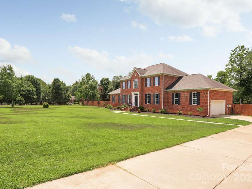 168 Harwell Road, Mooresville, NC 28117.  MLS# CAR4282323, YatesRealty ID 28807. Large double driveway for parking in the front of home inside gated area
