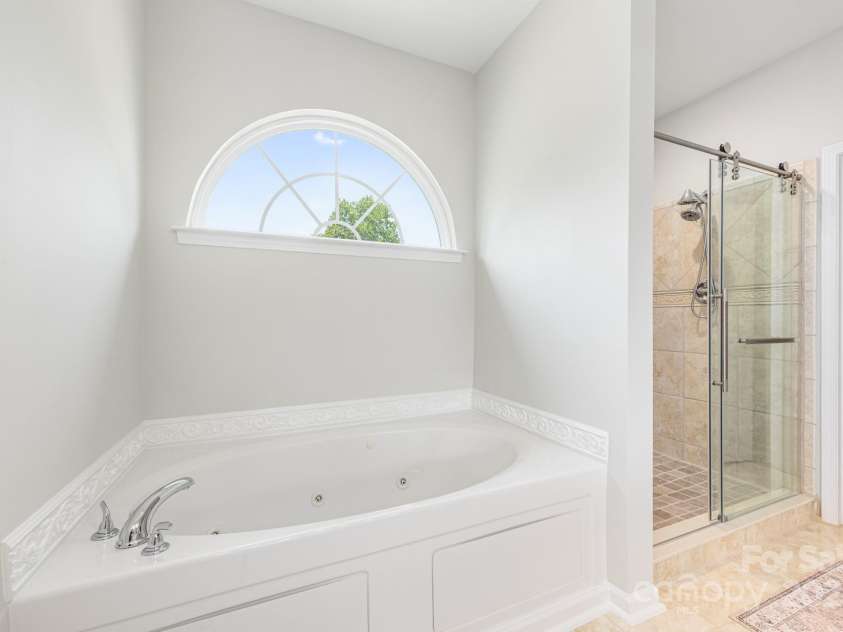 168 Harwell Road, Mooresville, NC 28117.  MLS# CAR4282323, YatesRealty ID 28807. Primary Bathroom 2nd view of shower and tub