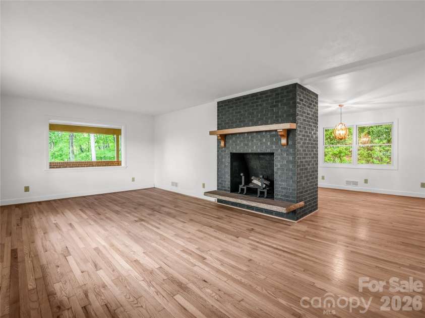 200 Little Wings Mountain Road, Columbus, NC 28722.  MLS# CAR4289310, YatesRealty ID 2881. Living room with Wood Fireplace