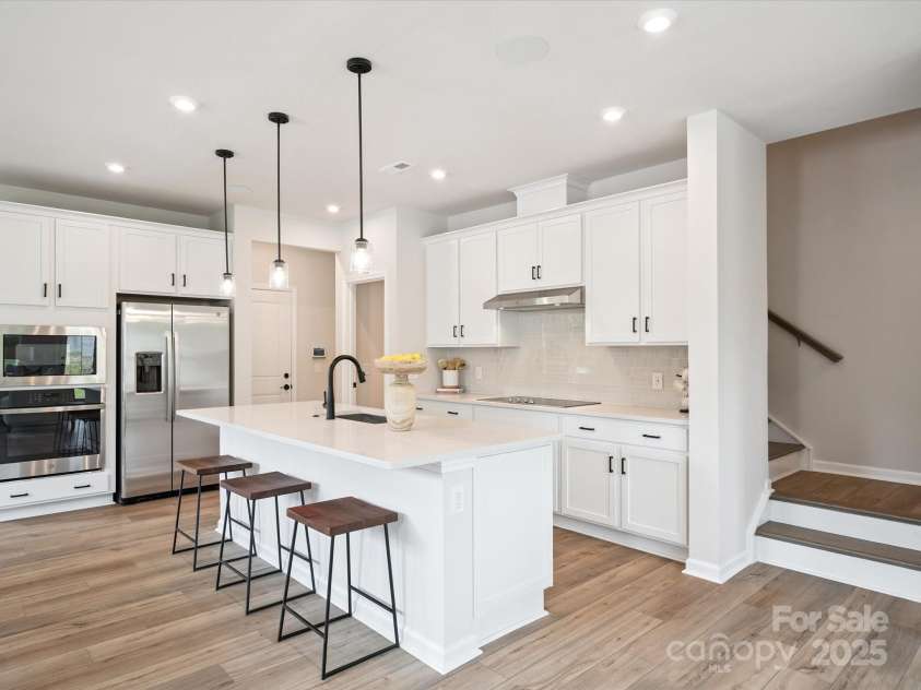 619 Webster Lane, Cramerton, NC 28032.  MLS# CAR4322006, YatesRealty ID 2881. Gourmet Kitchen Layout With Elegant White Cabinetry.  *Model Photos | Actual Finishes, Structural Selections, and Orientation May Vary.