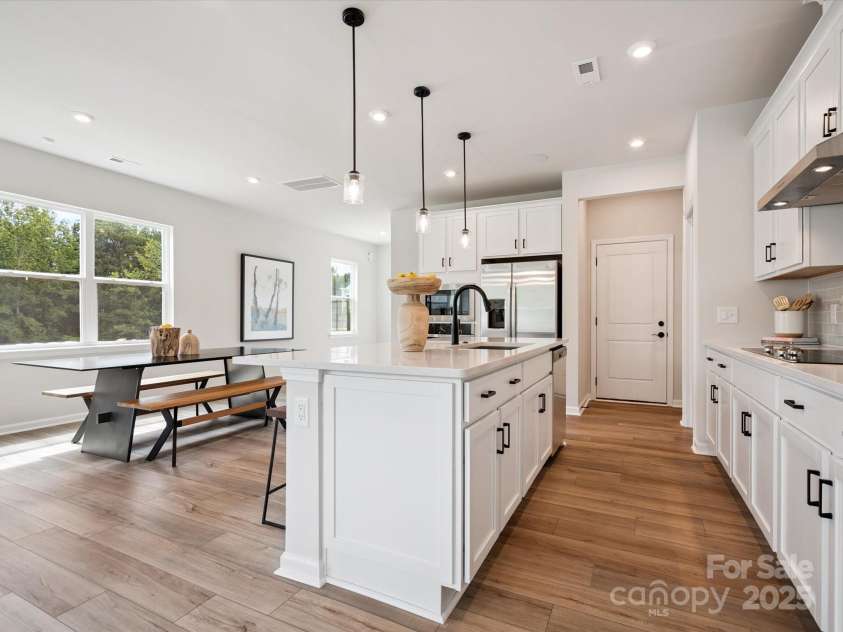 619 Webster Lane, Cramerton, NC 28032.  MLS# CAR4322006, YatesRealty ID 2881. Large Central Island Ideal For Entertaining or Casual Dining.  *Model Photos | Actual Finishes, Structural Selections, and Orientation May Vary.