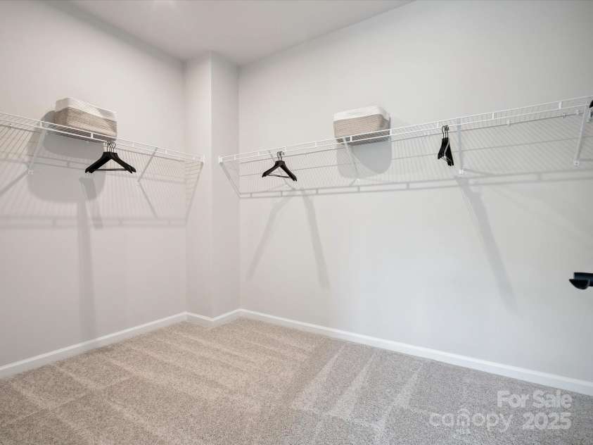 619 Webster Lane, Cramerton, NC 28032.  MLS# CAR4322006, YatesRealty ID 2881. Primary Walk-In Closet.  *Model Photos | Actual Finishes, Structural Selections, and Orientation May Vary.