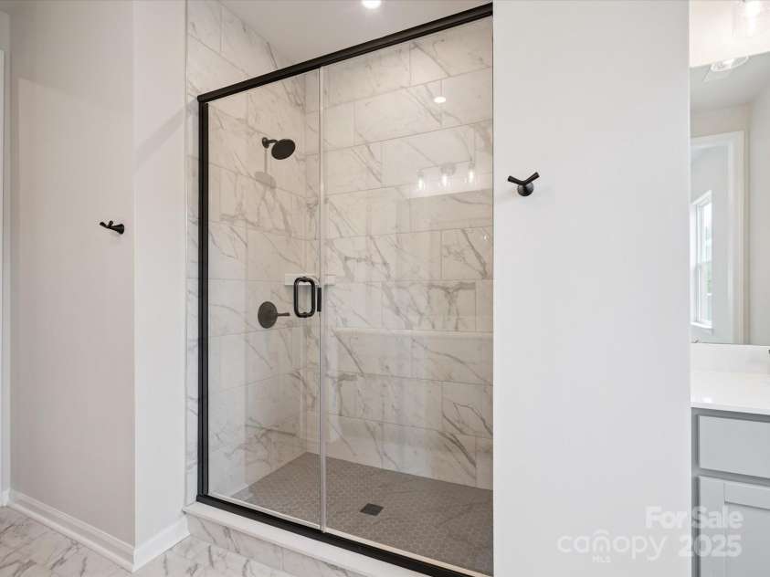 619 Webster Lane, Cramerton, NC 28032.  MLS# CAR4322006, YatesRealty ID 2881. Walk-In Tile Surround Shower at Primary Bath.  *Model Photos | Actual Finishes, Structural Selections, and Orientation May Vary.