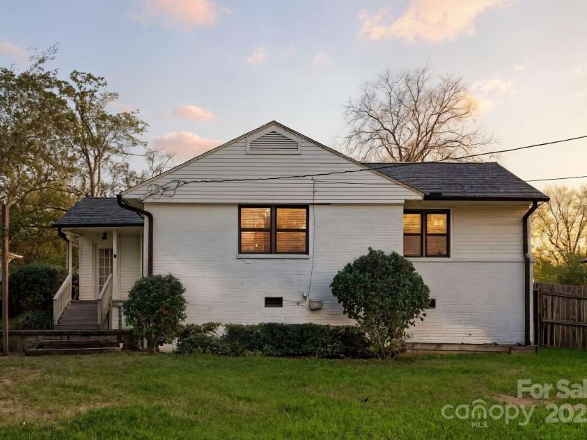 1120 Guilford Road, Charlotte, NC 28209.  MLS# CAR4284031, YatesRealty ID 28816. Rear Exterior Twilight