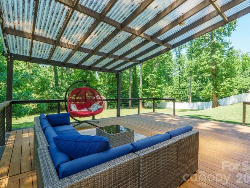 9027 Leah Meadow Lane, Charlotte, NC 28227.  MLS# CAR4384401, YatesRealty ID 28817. Deck oasis overlooking fenced backyard