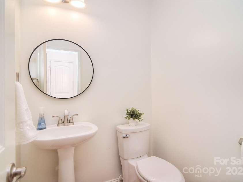 7006 Olde Sycamore Drive, Mint Hill, NC 28227.  MLS# CAR4279307, YatesRealty ID 28821. Main floor half bath