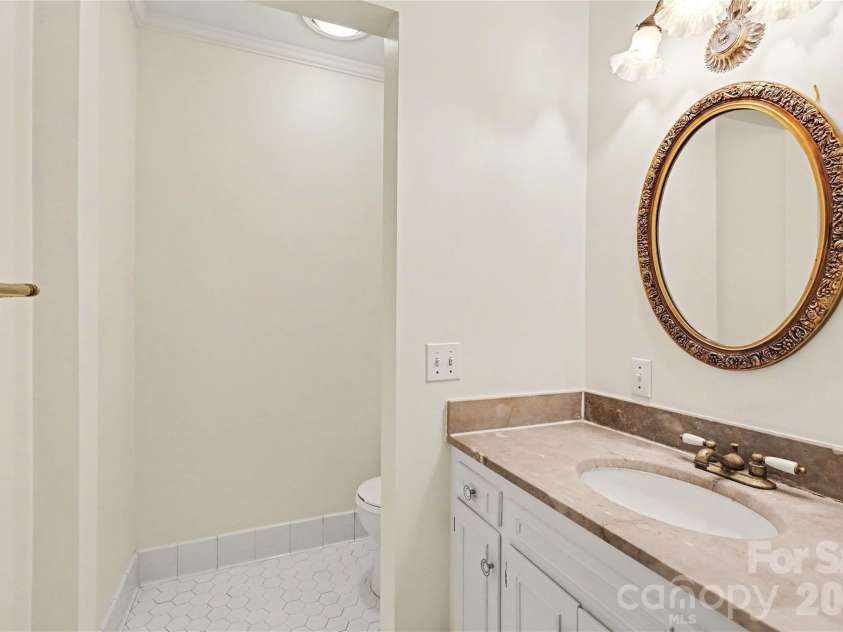 930 Scotch Drive, Gastonia, NC 28054.  MLS# CAR4385001, YatesRealty ID 28831. Main floor guest bathroom