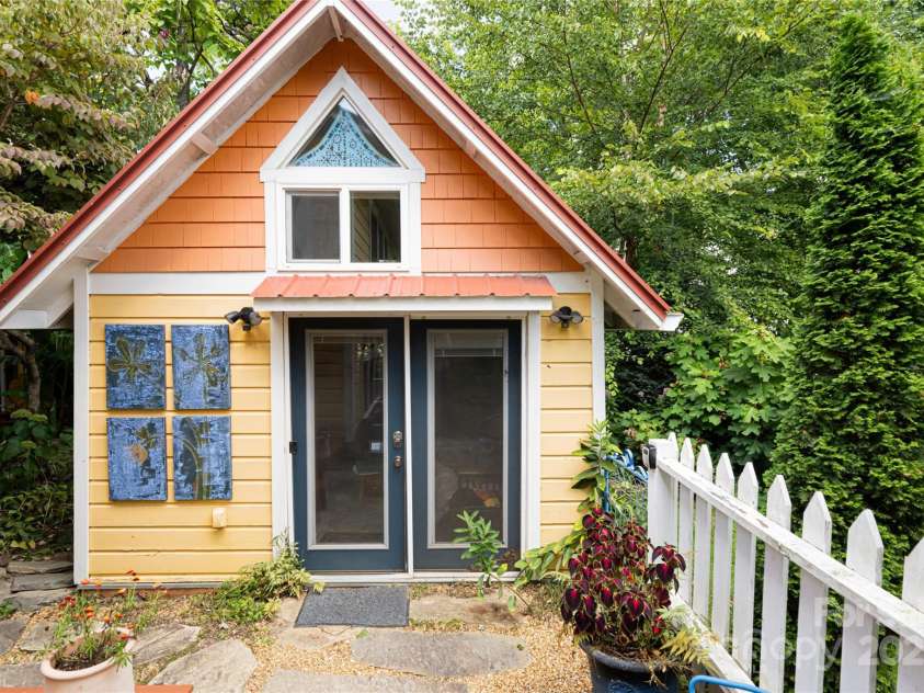 61 Elizabeth Place, Asheville, NC 28801.  MLS# CAR4213043, YatesRealty ID 2884. The Zen Cottage includes a lofted sleeping space, a ktichenette, and a full bathroom. More pictures are available in the MLS attachments.