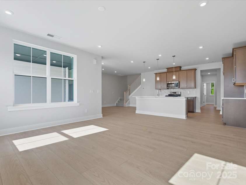 323 Ardmore Drive, Belmont, NC 28012.  MLS# CAR4319122, YatesRealty ID 28845. Great Room Surrounded by Energy Efficient Bright Windows.