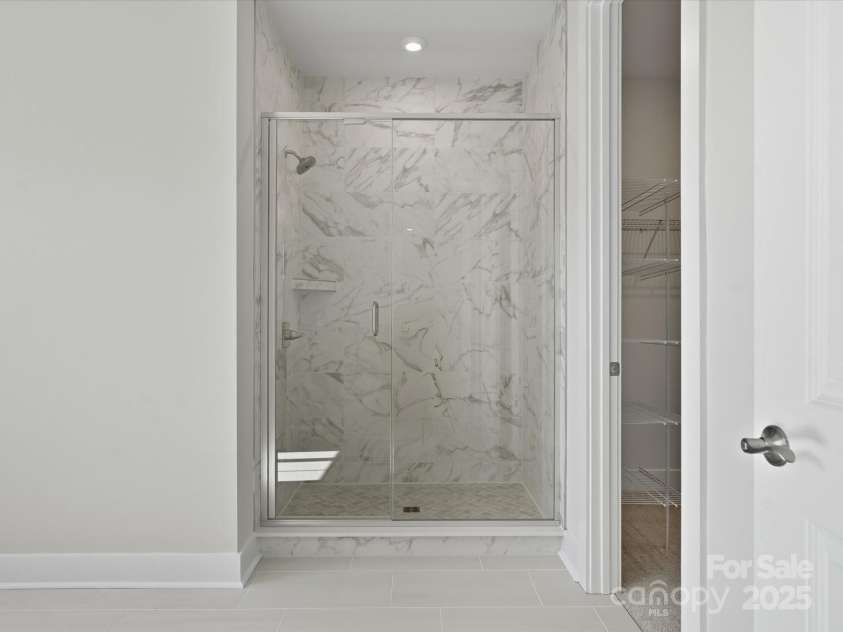 323 Ardmore Drive, Belmont, NC 28012.  MLS# CAR4319122, YatesRealty ID 28845. Modern Tiled Walk-In Primary Shower.
