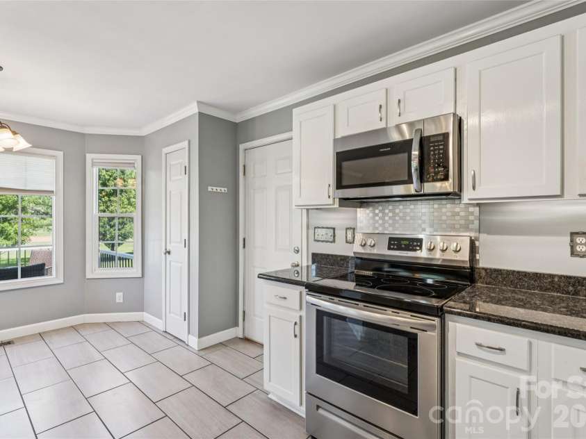 246 Maple Ridge Circle, Salisbury, NC 28147.  MLS# CAR4390588, YatesRealty ID 28849. Stainless appliances - garage entry to the right 