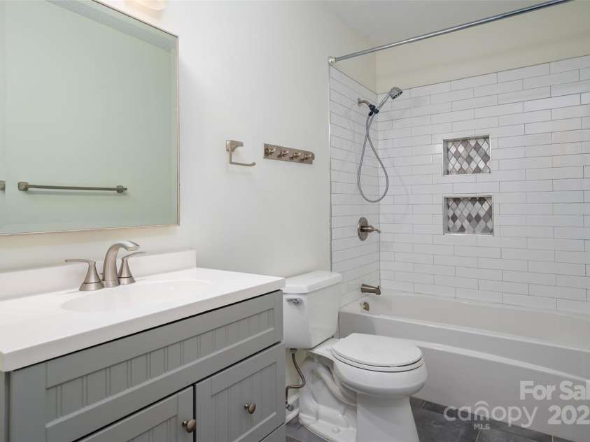 6013 Heath Valley Road, Charlotte, NC 28210.  MLS# CAR4276704, YatesRealty ID 28858. Fully updated full bathroom on the second level