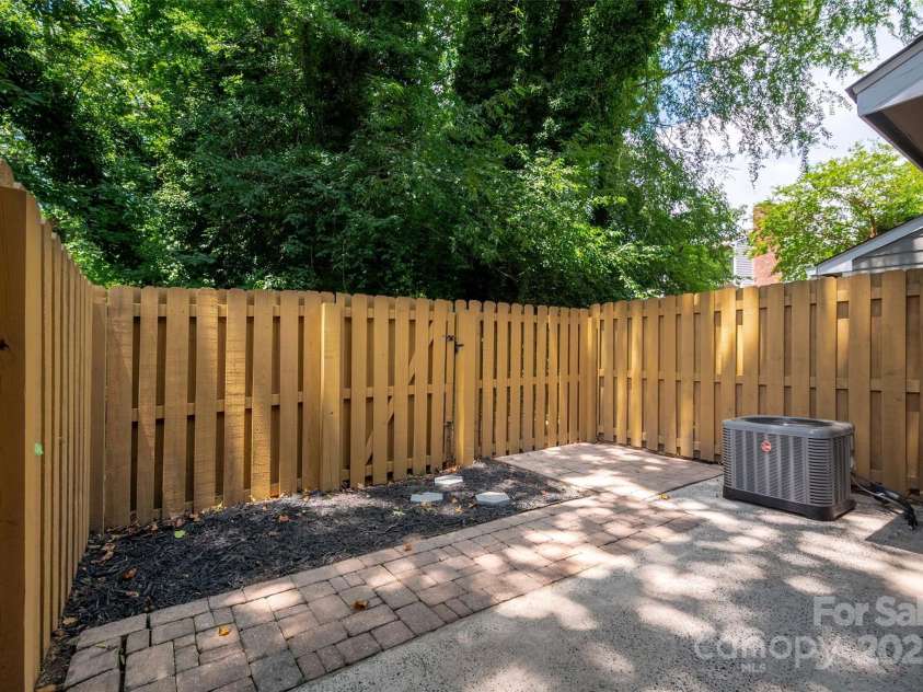 6013 Heath Valley Road, Charlotte, NC 28210.  MLS# CAR4276704, YatesRealty ID 28858. Secluded patio with room for entertaining & a garden!