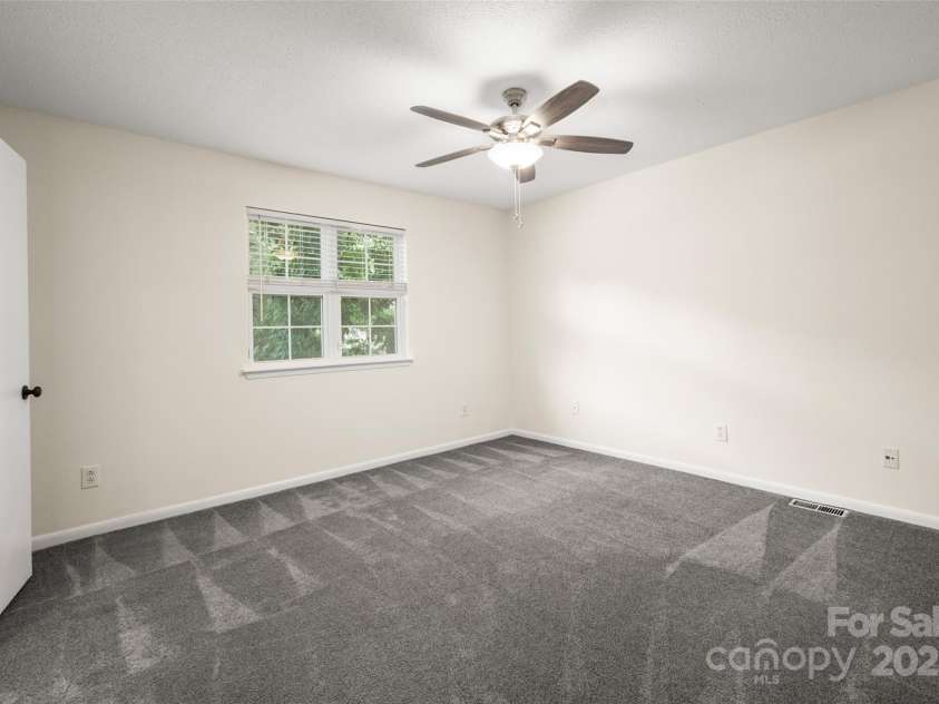 6013 Heath Valley Road, Charlotte, NC 28210.  MLS# CAR4276704, YatesRealty ID 28858. Secondary bedroom with beautiful natural light