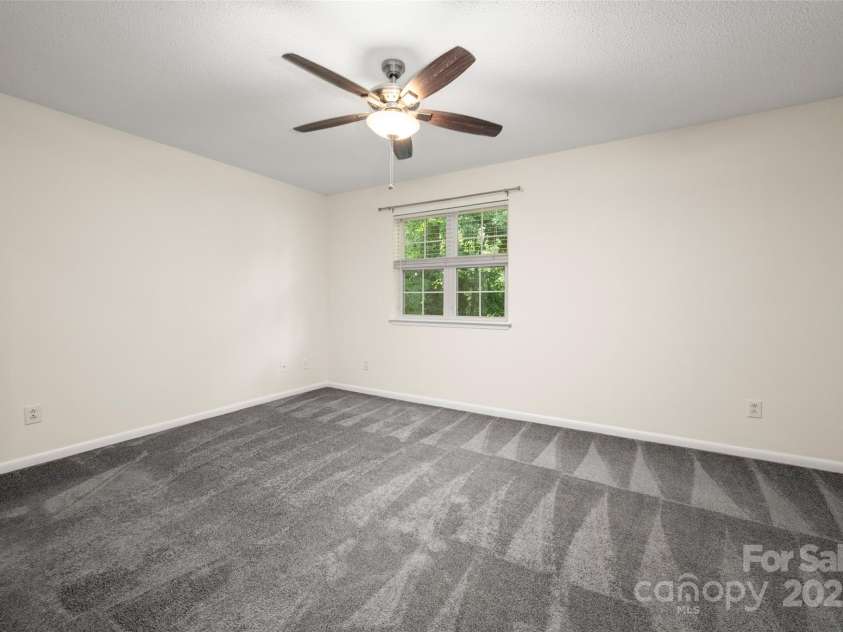 6013 Heath Valley Road, Charlotte, NC 28210.  MLS# CAR4276704, YatesRealty ID 28858. Spacious primary bedroom