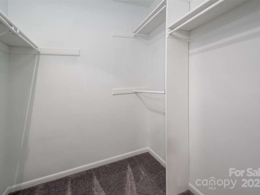 6013 Heath Valley Road, Charlotte, NC 28210.  MLS# CAR4276704, YatesRealty ID 28858. Walk-in closet located in the primary bedroom