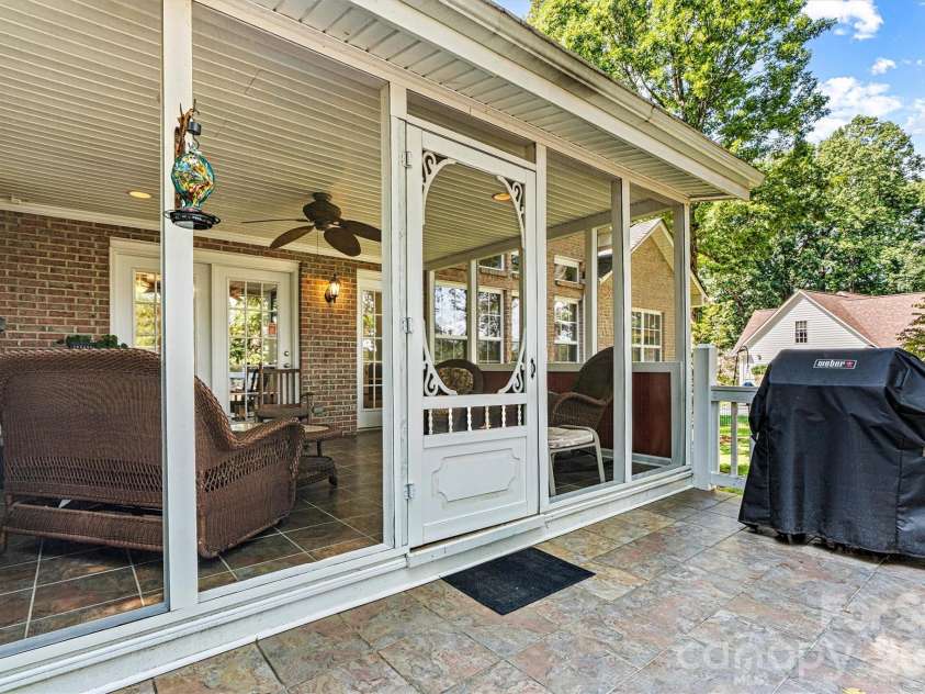 7538 Golf Course Drive, Denver, NC 28037.  MLS# CAR4375183, YatesRealty ID 28863. Deck off the screened-in rear porch
