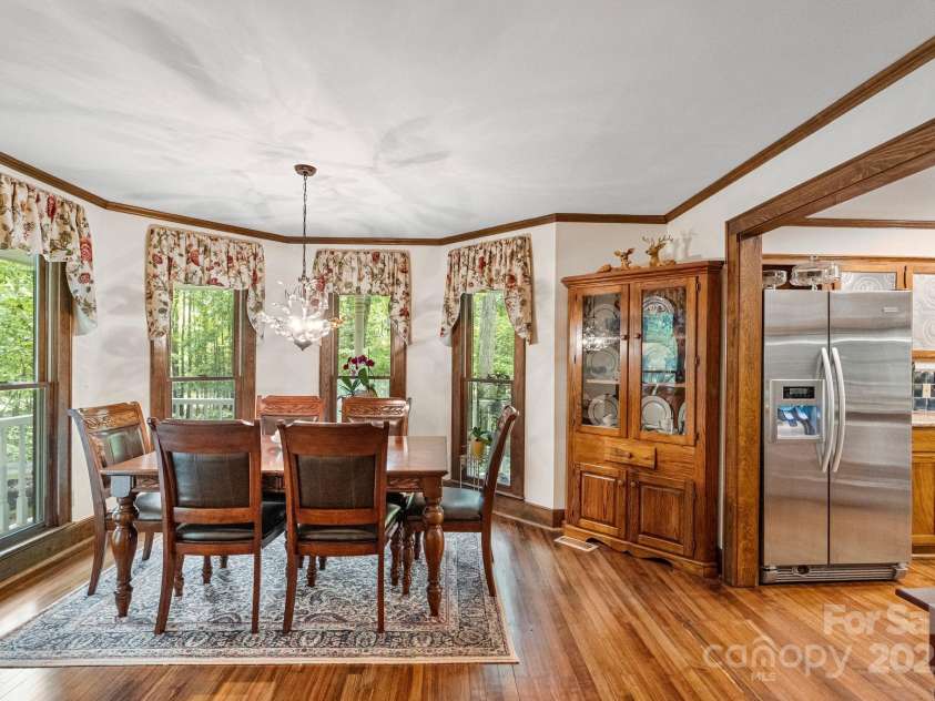110 Amanda Drive, Matthews, NC 28104.  MLS# CAR4280480, YatesRealty ID 28865. Dining room accented by floor to ceiling windows