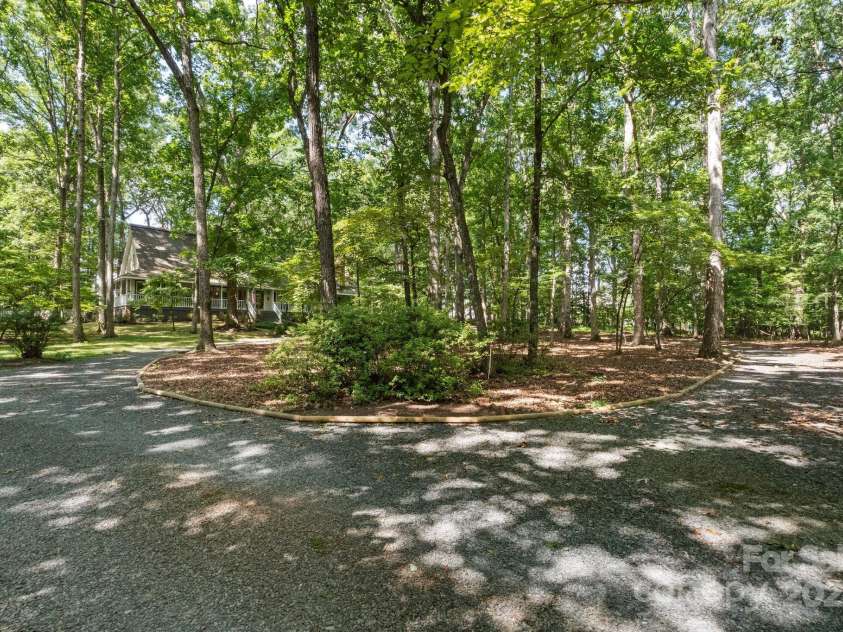 110 Amanda Drive, Matthews, NC 28104.  MLS# CAR4280480, YatesRealty ID 28865. Your private retreat awaits!