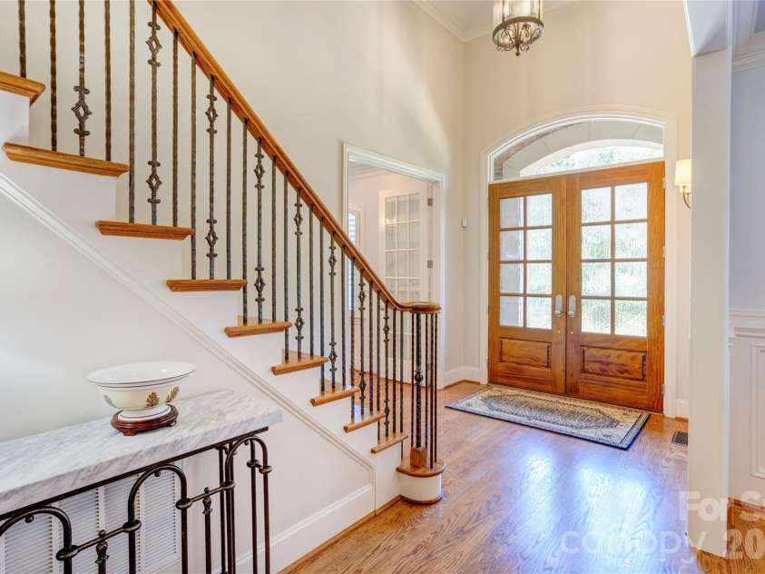 6005 Willowood Road, Kannapolis, NC 28081.  MLS# CAR4389697, YatesRealty ID 28865. Classic staircase to the upper floor